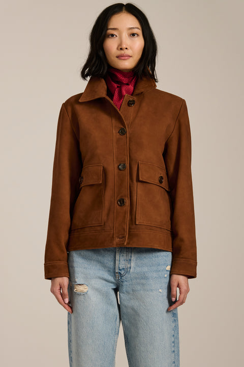 Genuine suede utility jacket with point collar, concealed button-front closure and oversized flap pockets.