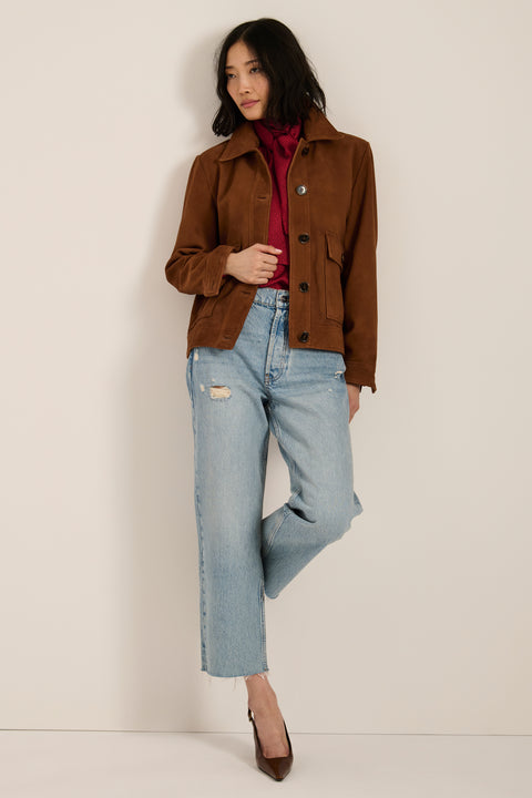 Genuine suede utility jacket with point collar, concealed button-front closure and oversized flap pockets.
