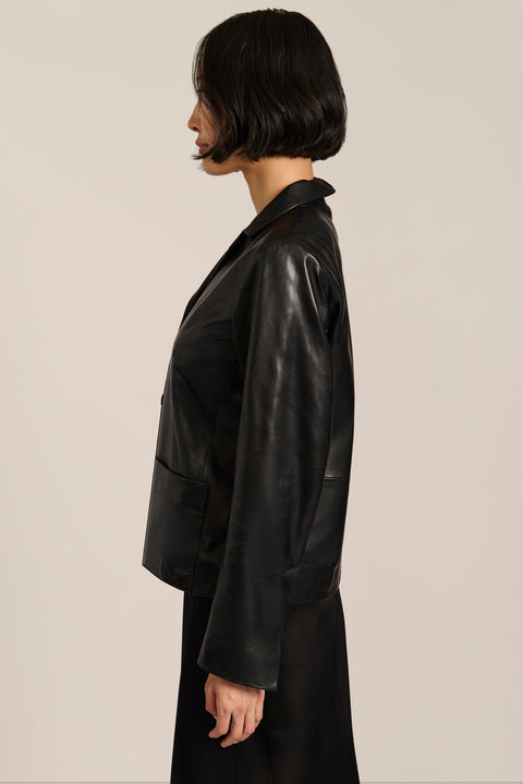 Women's genuine leather blazer with button-front closure and front patch pockets