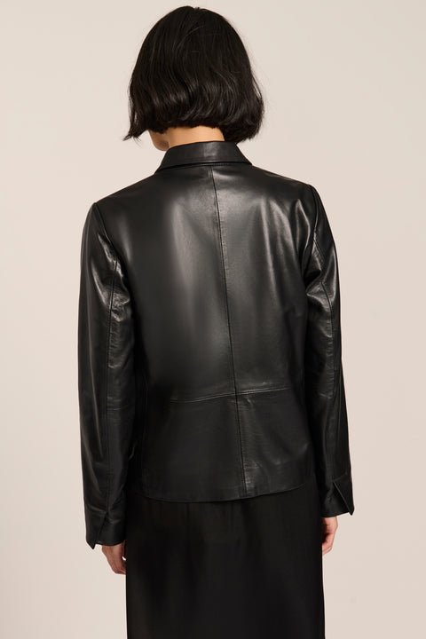 Women's genuine leather blazer with button-front closure and front patch pockets