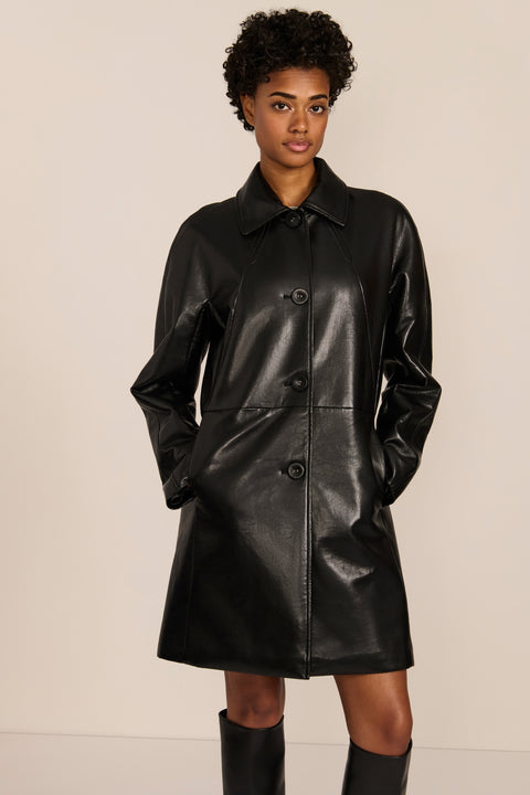 Women's black genuine leather car coat with point collar, button-front closure and side pockets.