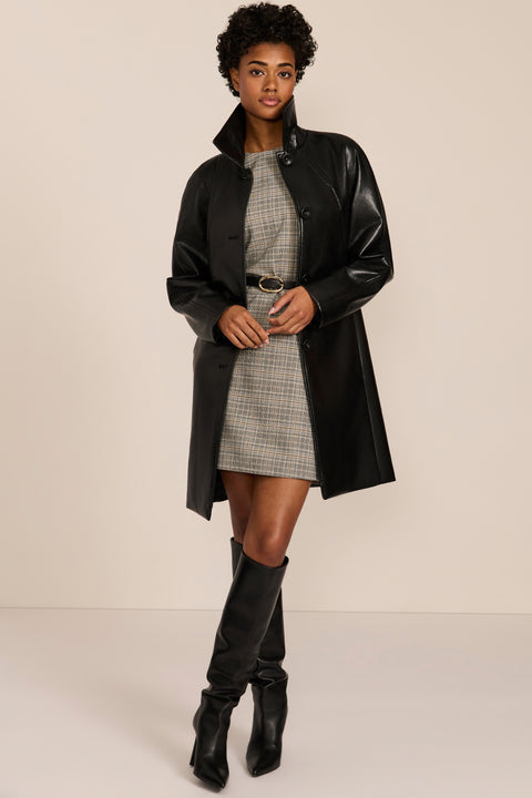 Women's black genuine leather car coat with point collar, button-front closure and side pockets.