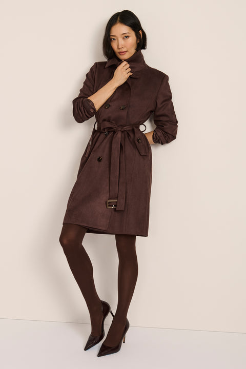 women's faux suede trench coat with a double-breasted front, notched lapels, belted waist and buckle cuff details.