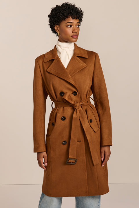 women's faux suede trench coat with a double-breasted front, notched lapels, belted waist and buckle cuff details.