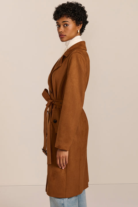 women's faux suede trench coat with a double-breasted front, notched lapels, belted waist and buckle cuff details.
