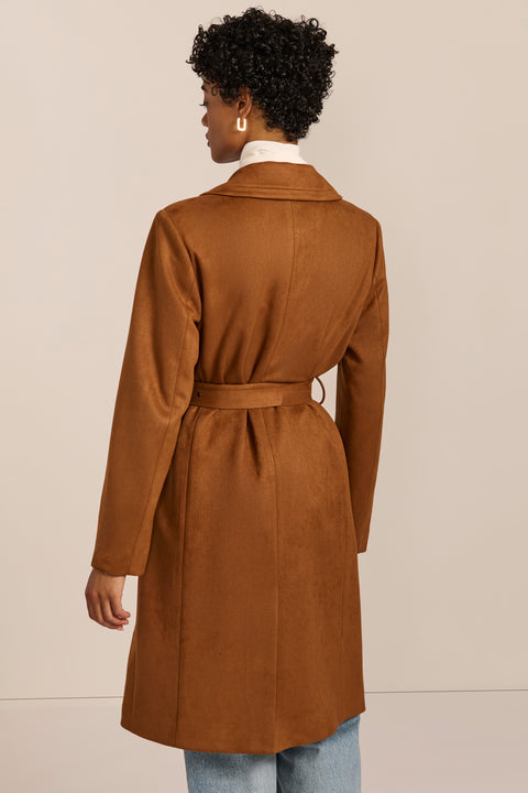 women's faux suede trench coat with a double-breasted front, notched lapels, belted waist and buckle cuff details.