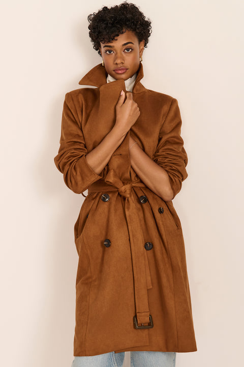 women's faux suede trench coat with a double-breasted front, notched lapels, belted waist and buckle cuff details.