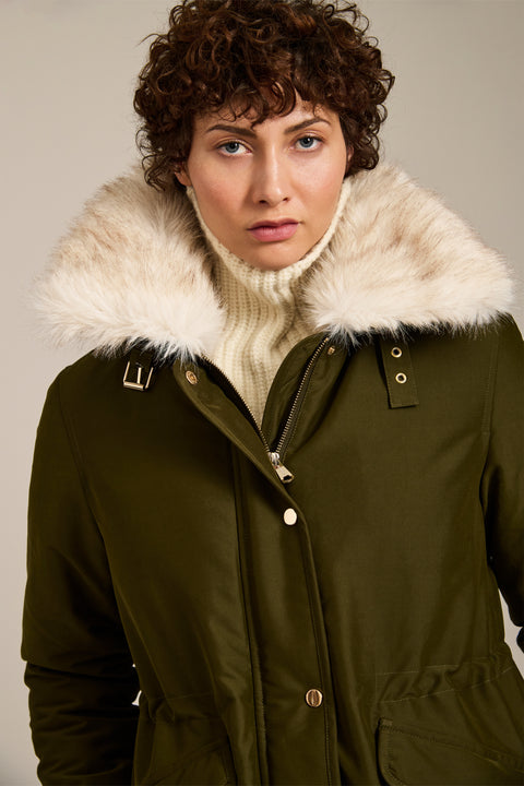 Insulated parka with removable faux fur collar, drawstring waist, oversized utility pockets and hidden zip closure.