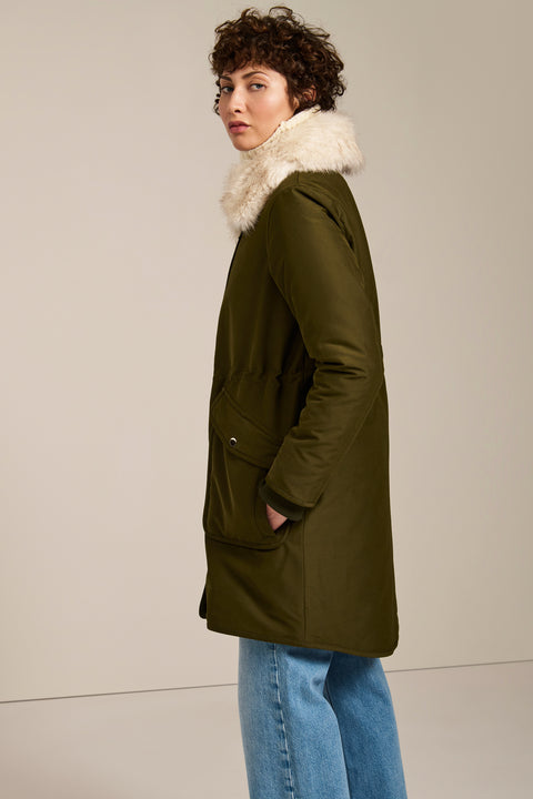 Insulated parka with removable faux fur collar, drawstring waist, oversized utility pockets and hidden zip closure.