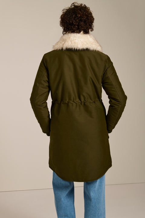 Insulated parka with removable faux fur collar, drawstring waist, oversized utility pockets and hidden zip closure.