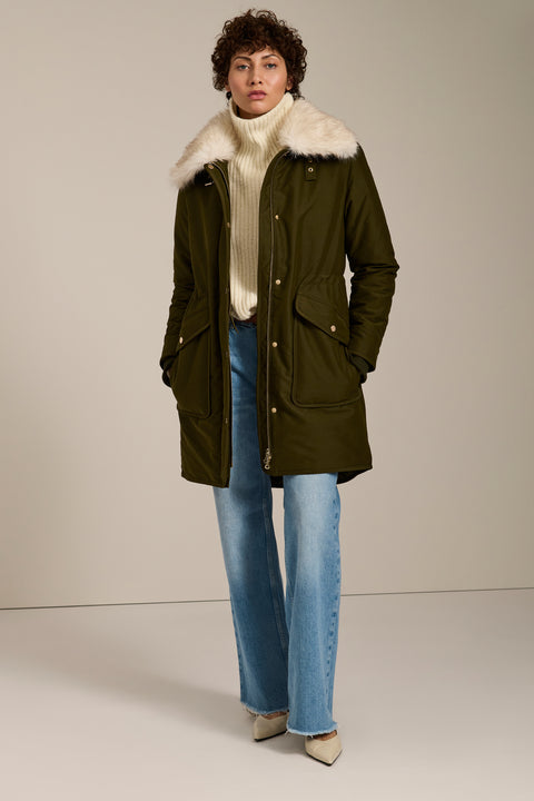 Insulated parka with removable faux fur collar, drawstring waist, oversized utility pockets and hidden zip closure.