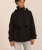 Women's hooded raincoat with drawstring waist, storm flap, side pockets and adjustable cuffs.