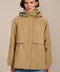 Women's hooded raincoat with drawstring waist, storm flap, side pockets and adjustable cuffs.