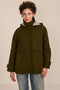 Women's hooded raincoat with drawstring waist, storm flap, side pockets and adjustable cuffs.
