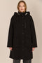 Women's black All-Weather Parka with an oversized hood, utility pockets and longline silhouette.