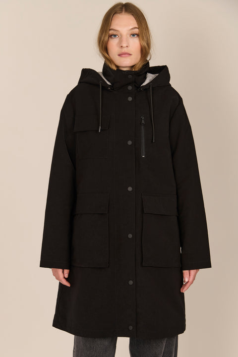 Women's black All-Weather Parka with an oversized hood, utility pockets and longline silhouette.