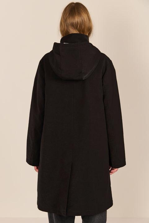 Women's black All-Weather Parka with an oversized hood, utility pockets and longline silhouette.