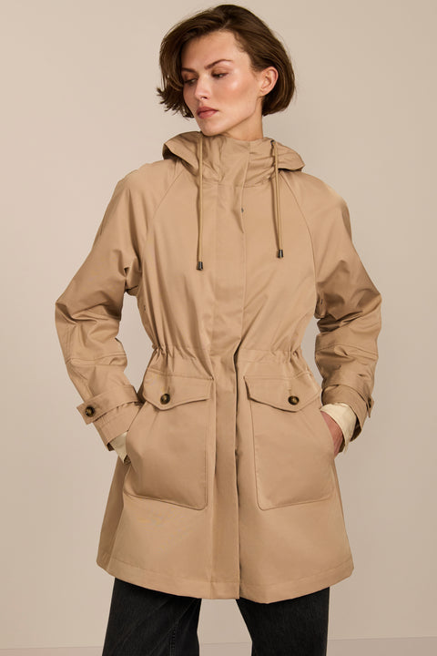 Women's raincoat with drawstring waist and hood.