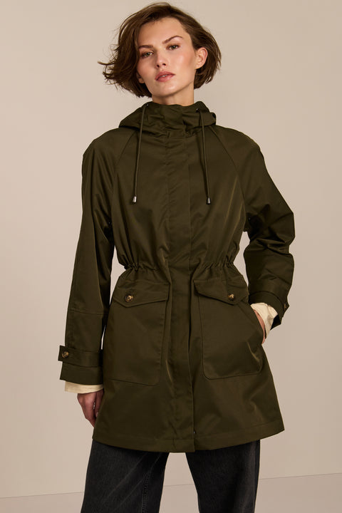 Women's raincoat with drawstring waist and hood.