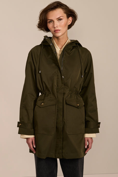 Women's raincoat with drawstring waist and hood.