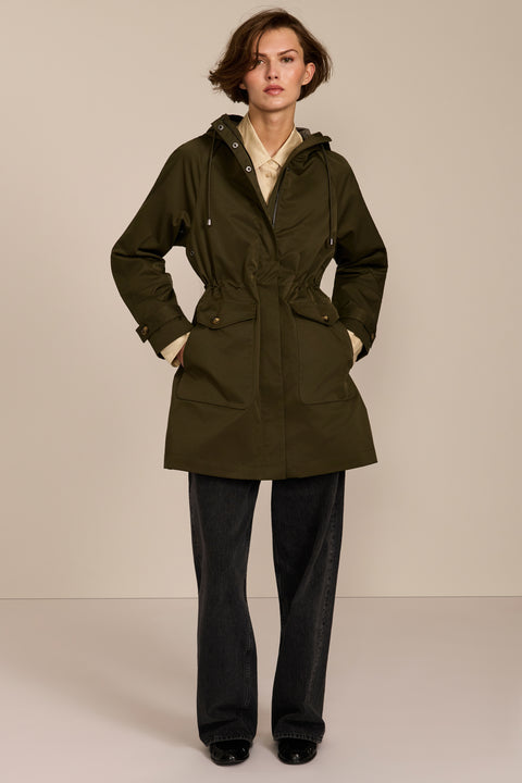 Women's raincoat with drawstring waist and hood.
