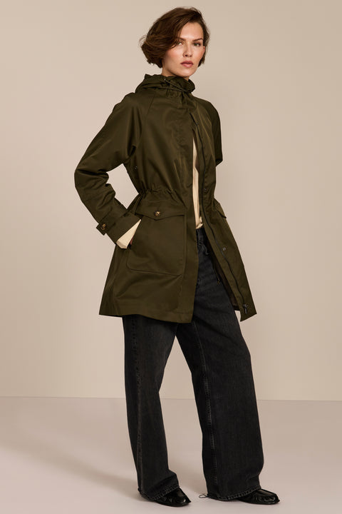 Women's raincoat with drawstring waist and hood.