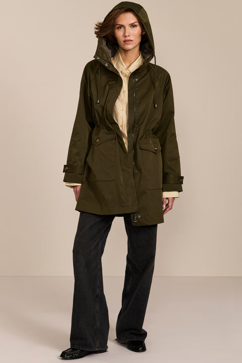 Women's raincoat with drawstring waist and hood.
