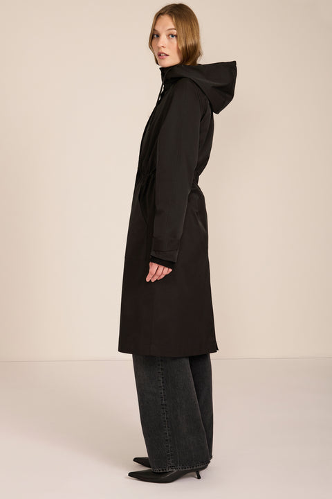 Women's water-repellent hooded raincoat with adjustable drawcord waist and patch pockets