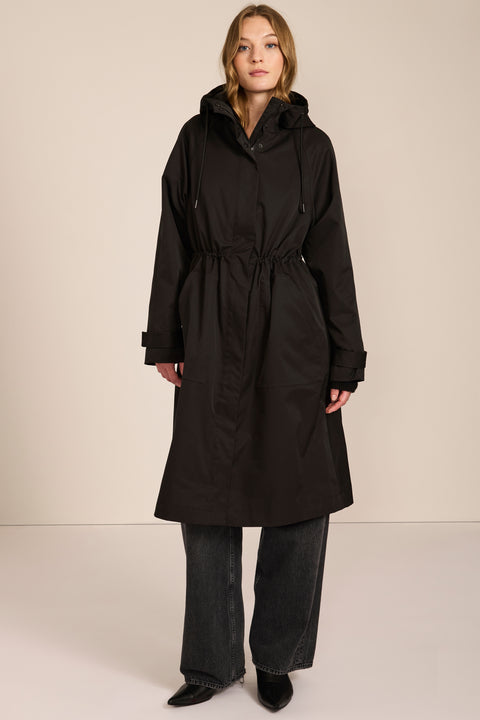 Women's water-repellent hooded raincoat with adjustable drawcord waist and patch pockets