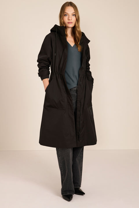 Women's water-repellent hooded raincoat with adjustable drawcord waist and patch pockets
