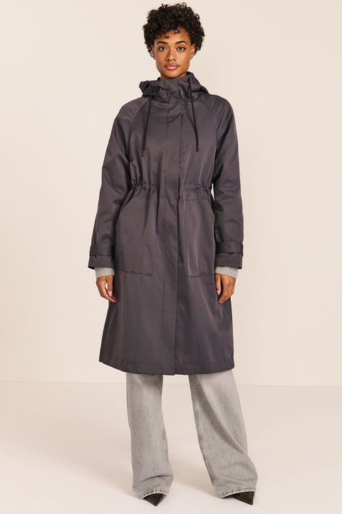 Women's water-repellent hooded raincoat with adjustable drawcord waist and patch pockets