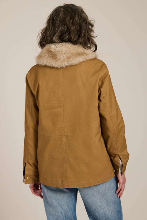 Utility jacket with removable faux fur collar, drawstring waist, oversized flap pockets and hidden zip closure.