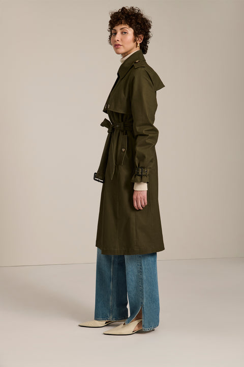 Women's belted trench coat with double-breasted front and water-repellent fabric.
