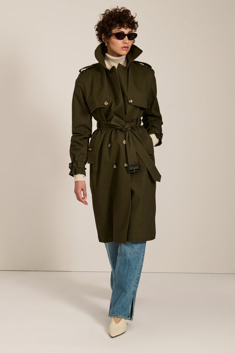 Women's belted trench coat with double-breasted front and water-repellent fabric.