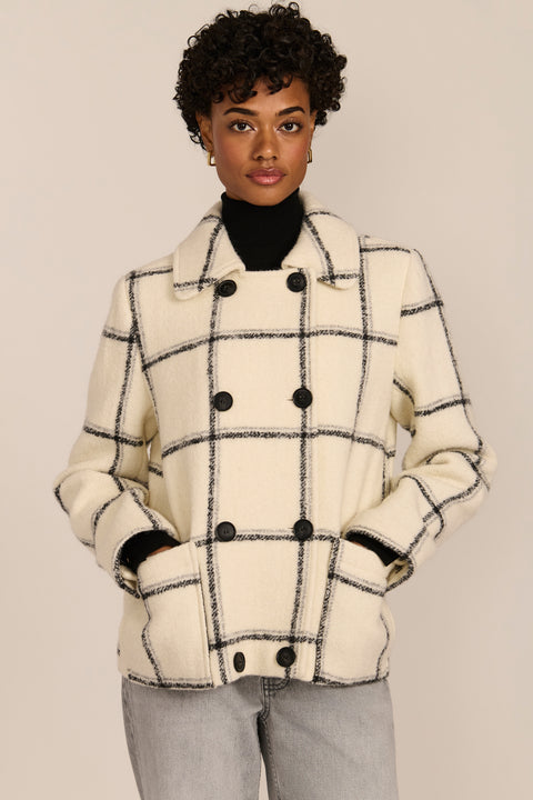 women's Double-Breasted Bouclé Jacket in ivory with a black windowpane pattern, pointed collar and patch pockets.