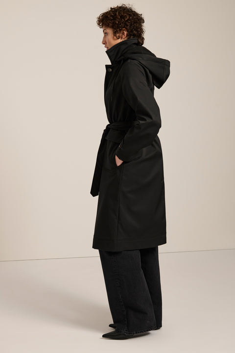 Women's belted raincoat with removable hood and water-repellent finish.