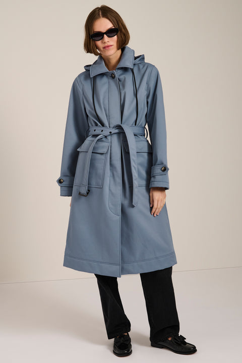 Women's belted raincoat with removable hood and water-repellent finish.