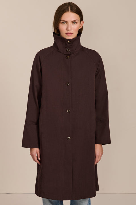 Women's two in one raincoat with removable quilted vest.