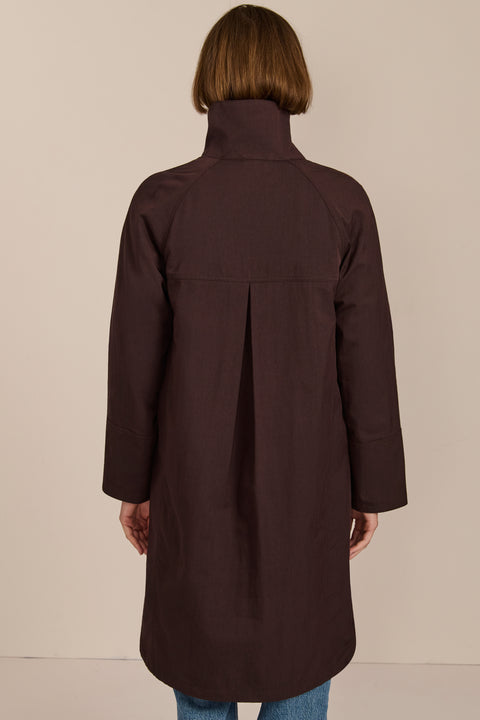 Women's two in one raincoat with removable quilted vest.