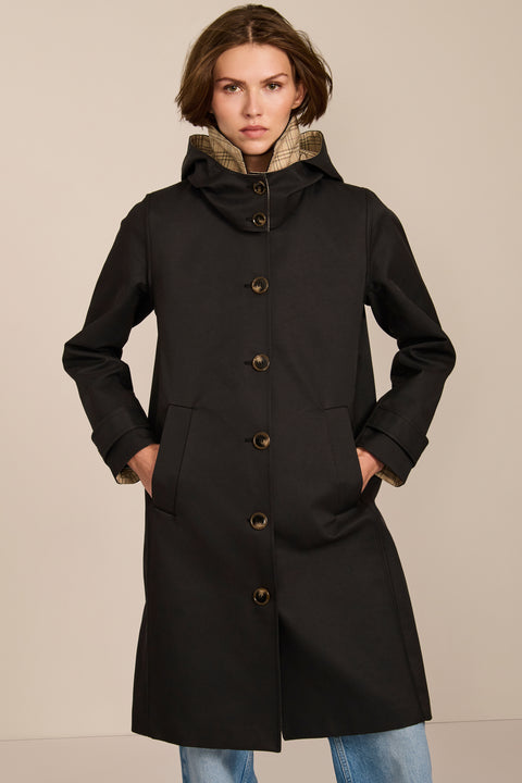 women's plaid-trim raincoat with a hood, stand collar, button-front closure, welt pockets and adjustable cuff tabs.