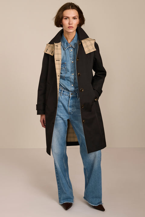 women's plaid-trim raincoat with a hood, stand collar, button-front closure, welt pockets and adjustable cuff tabs.