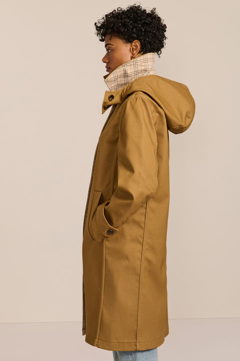 women's plaid-trim raincoat with a hood, stand collar, button-front closure, welt pockets and adjustable cuff tabs.