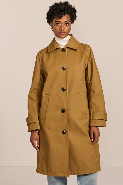 women's plaid-trim raincoat with a hood, stand collar, button-front closure, welt pockets and adjustable cuff tabs.