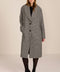 Women's brown houndstooth long coat with oversized notched collar, two-button closure and welt pockets.