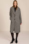 Women's brown houndstooth long coat with oversized notched collar, two-button closure and welt pockets.