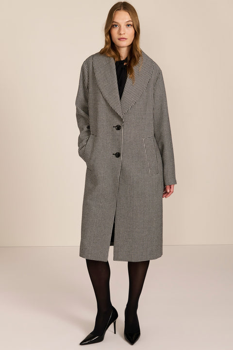 Women's brown houndstooth long coat with oversized notched collar, two-button closure and welt pockets.