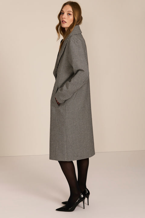 Women's brown houndstooth long coat with oversized notched collar, two-button closure and welt pockets.