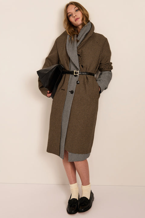 Women's brown houndstooth long coat with oversized notched collar, two-button closure and welt pockets.