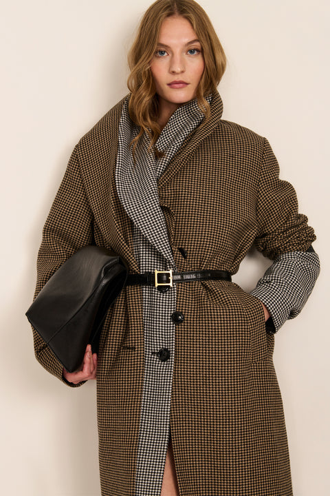 Women's brown houndstooth long coat with oversized notched collar, two-button closure and welt pockets.