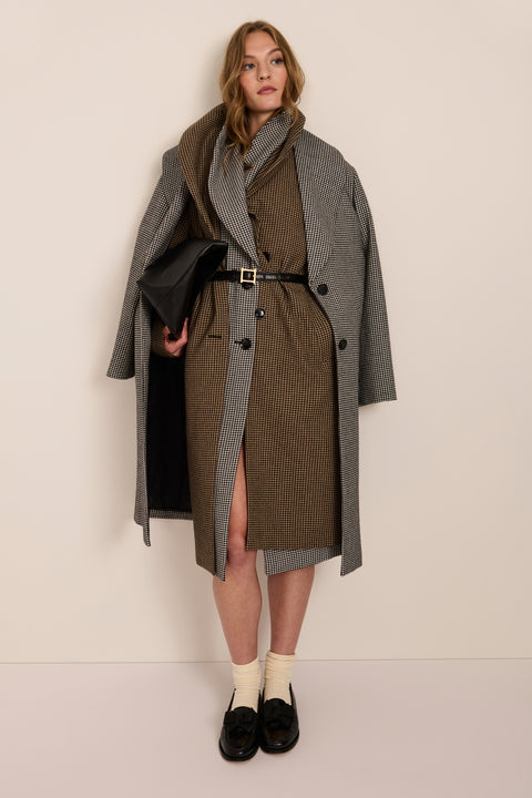 Women's brown houndstooth long coat with oversized notched collar, two-button closure and welt pockets.